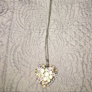 Long pendent shiny metal heart